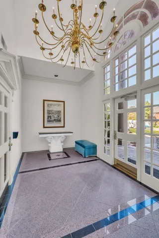 a living room with furniture and large window