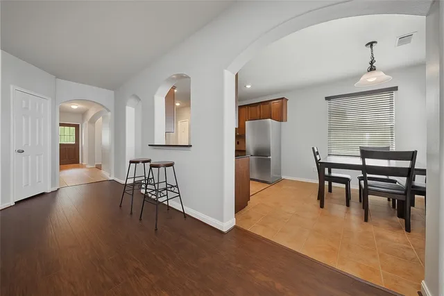 a view of a dining room with furniture window and wooden floor