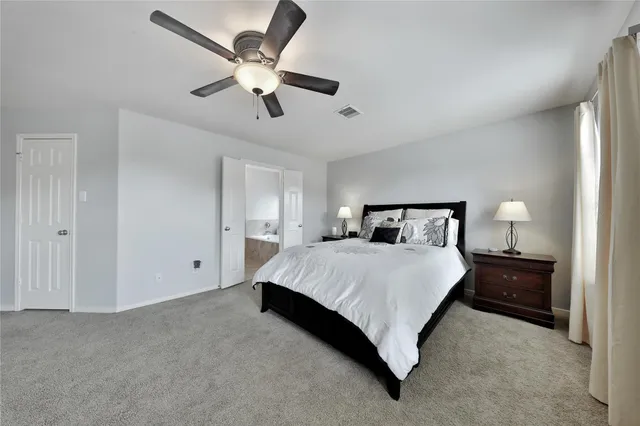 a bedroom with a bed and window