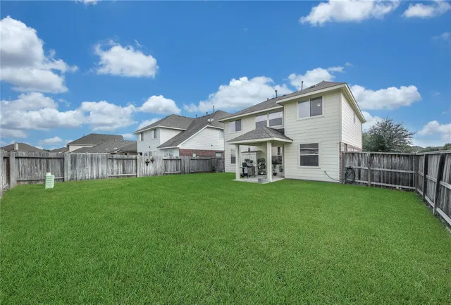 a view of a house with backyard