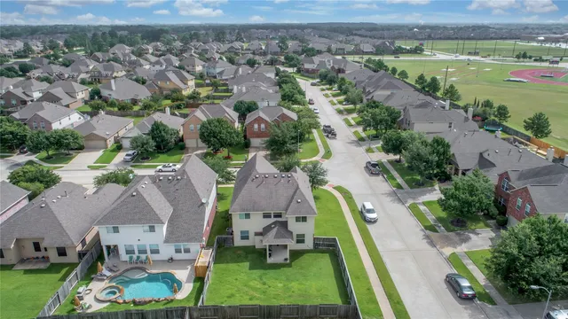 an aerial view of a house with a garden