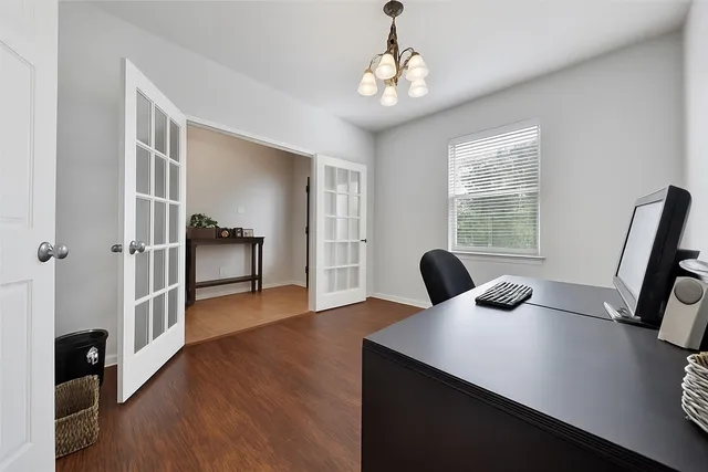 a view of a livingroom with furniture and wooden floor