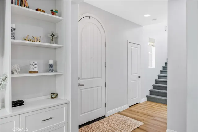 a view of an entryway with wooden floor
