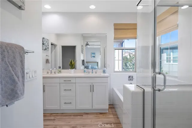a spacious bathroom with a granite countertop sink and a mirror