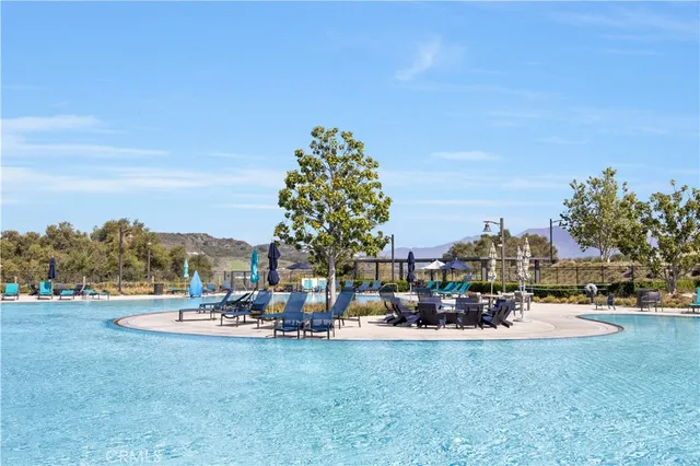 a view of a swimming pool with lounge chair