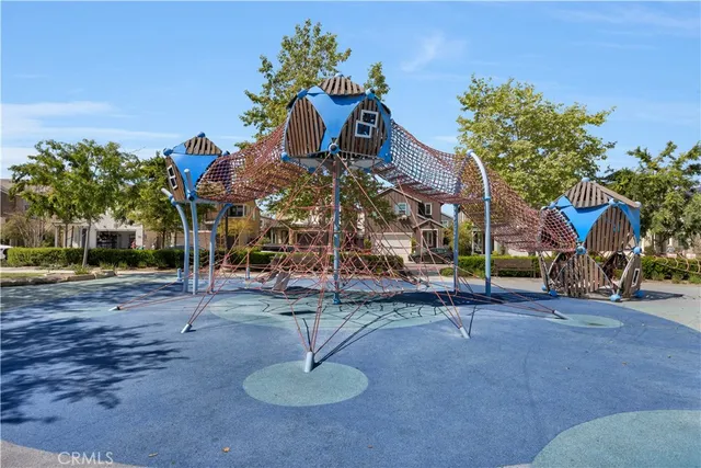 an aerial view of a swimming pool with a mountain and a lake view