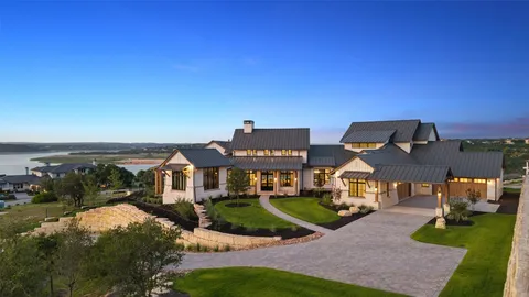 a front view of multiple houses with yard