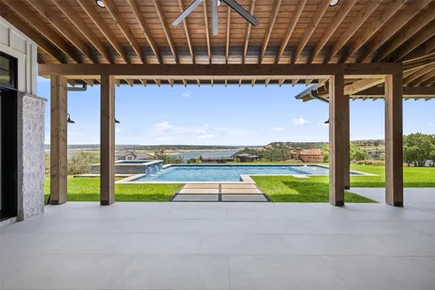 a view of swimming pool with outdoor seating