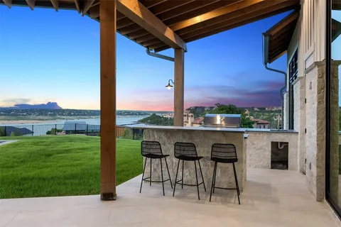 a view of a patio with a table and chairs