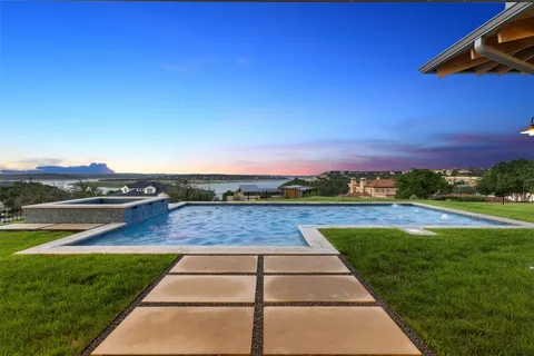 a view of swimming pool with lounge chair