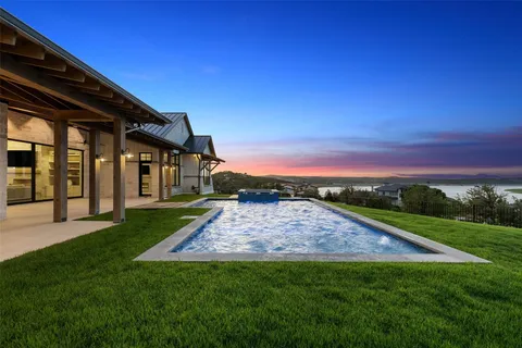 a view of an house with backyard space and garden