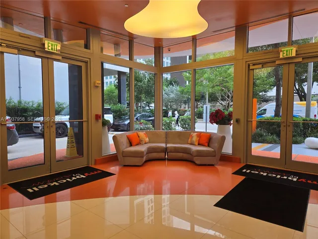 a outdoor space with patio couches and a potted plant