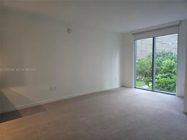 a view of a room with a large window