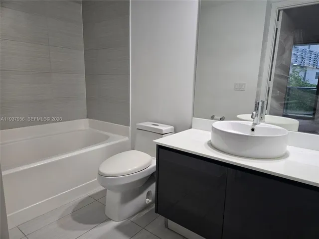 a bathroom with a sink toilet and a bathtub