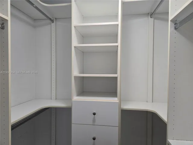 a view of an empty walk in closet