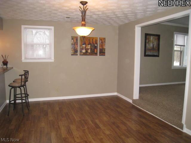 1899 Killian Road Akron, OH 44312 - Photo 8 of 16 Dining room with new laminate flooring.