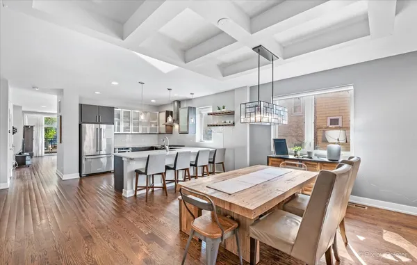 a view of a dining room with furniture and wooden floor