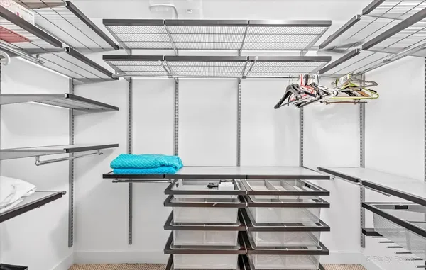 a view of a room with racks on the wall