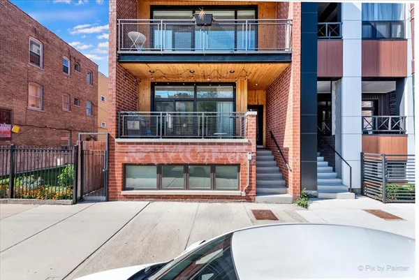 a brick building with a window and entrance