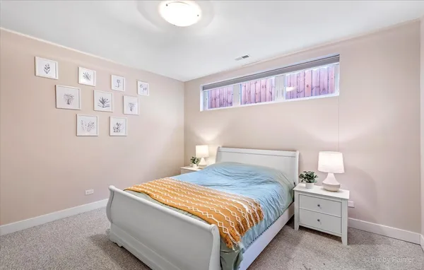 a bedroom with a bed and cabinets