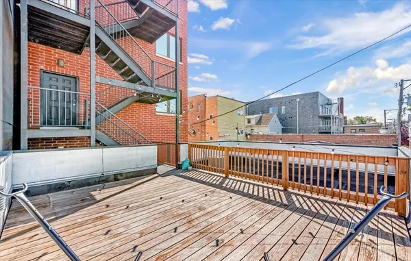 a view of balcony with wooden floor