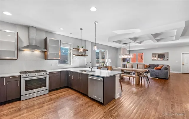 a kitchen with lots of counter top space and stainless steel appliances