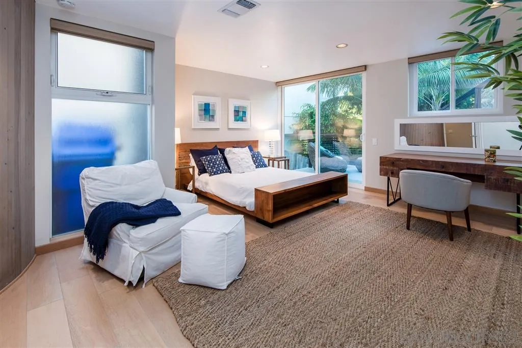 2134 Cordero Road Del Mar, CA 92014 - Photo 13 of 25 a bedroom with two beds and a large window