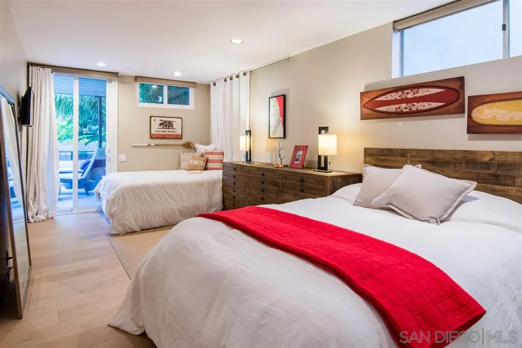 2134 Cordero Road Del Mar, CA 92014 - Photo 15 of 25 a bedroom with two beds and a large window