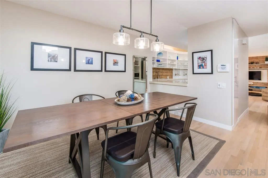 2134 Cordero Road Del Mar, CA 92014 - Photo 10 of 25 a view of a dining room with furniture and wooden floor