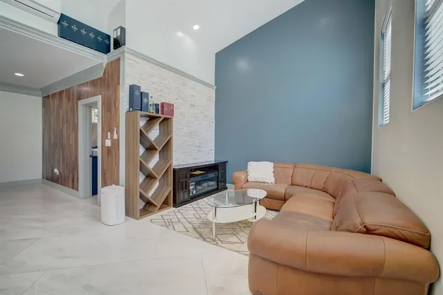 a living room with furniture a washer and dryer