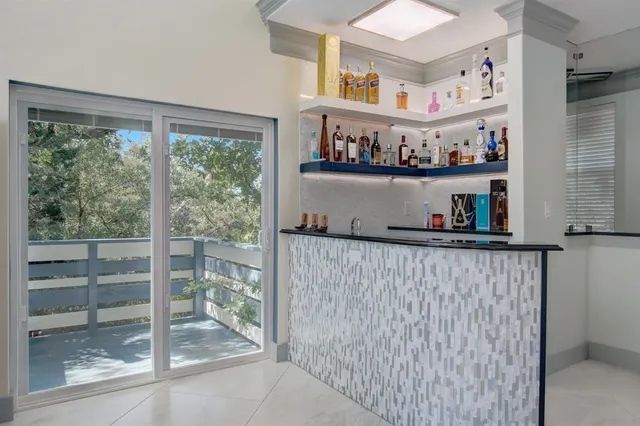 a kitchen with lots of clutter and cabinets