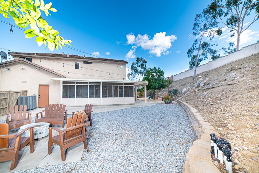 17801 Morning Rock Circle Riverside, CA 92503 - Photo 17 of 18 a view of a house with a yard and sitting area