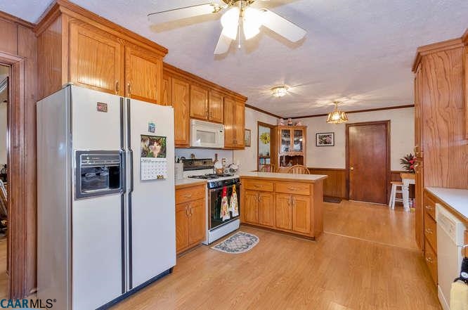 325 Firefly Lane Rice, VA 23966 - Photo 9 of 49 a kitchen with stainless steel appliances granite countertop a refrigerator a stove and a sink with cabinets
