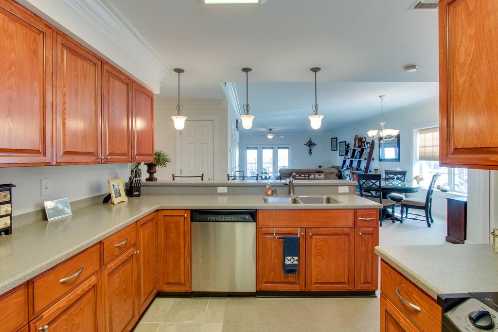 7100 Dale Ridge Road, Unit C2 Lancaster, TN 38569 - Photo 11 of 24 a kitchen with stainless steel appliances granite countertop a sink a stove and a wooden floors
