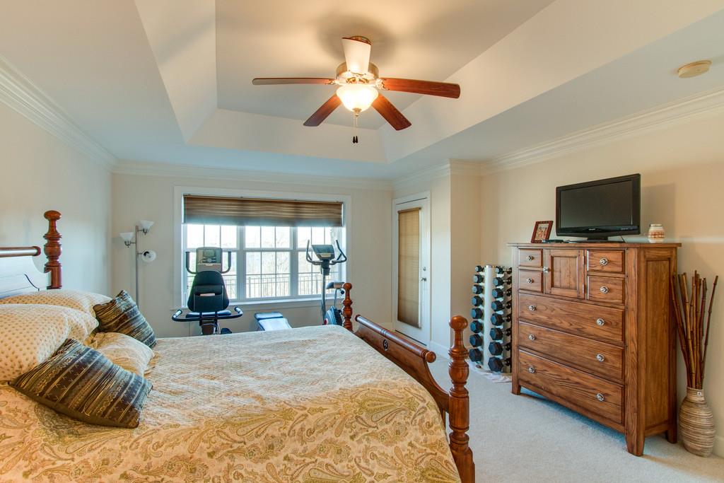 7100 Dale Ridge Road, Unit C2 Lancaster, TN 38569 - Photo 13 of 24 a bedroom with a bed and a flat screen tv