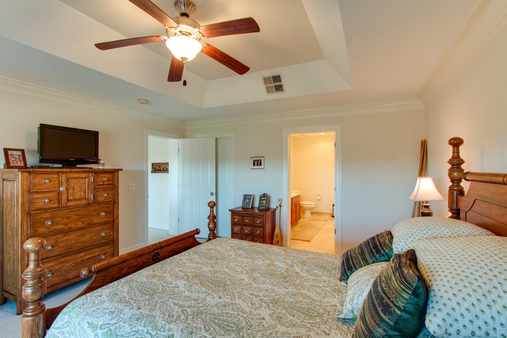 7100 Dale Ridge Road, Unit C2 Lancaster, TN 38569 - Photo 14 of 24 a bedroom with a bed and a flat screen tv