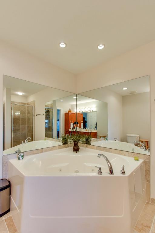 7100 Dale Ridge Road, Unit C2 Lancaster, TN 38569 - Photo 16 of 24 a large bathroom with a tub and mirror