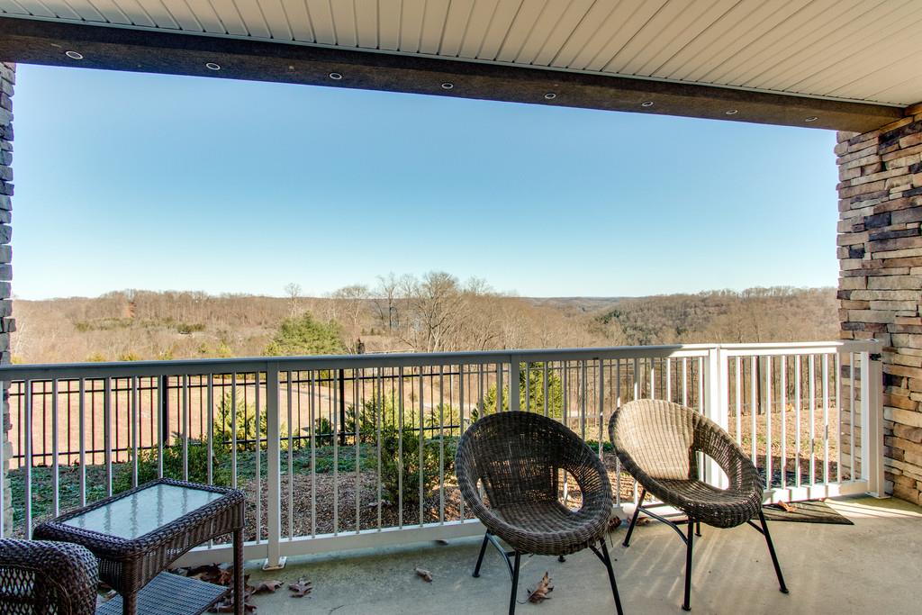 7100 Dale Ridge Road, Unit C2 Lancaster, TN 38569 - Photo 20 of 24 a view of a balcony with chairs