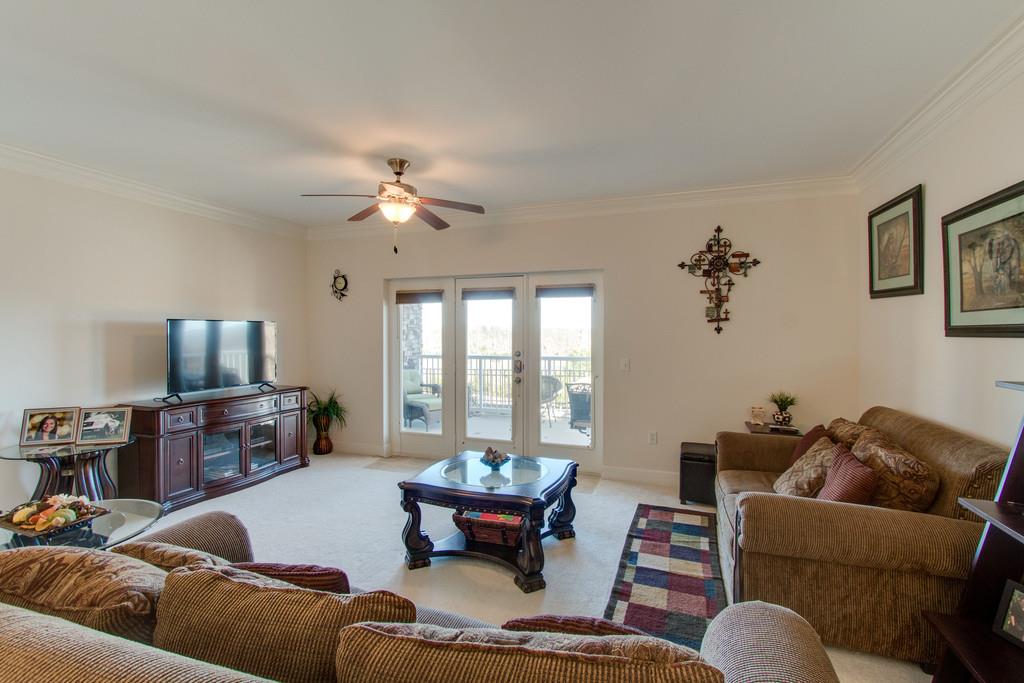 7100 Dale Ridge Road, Unit C2 Lancaster, TN 38569 - Photo 2 of 24 a living room with furniture and a flat screen tv