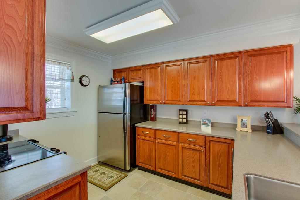 7100 Dale Ridge Road, Unit C2 Lancaster, TN 38569 - Photo 9 of 24 a kitchen with stainless steel appliances granite countertop a refrigerator sink and cabinets