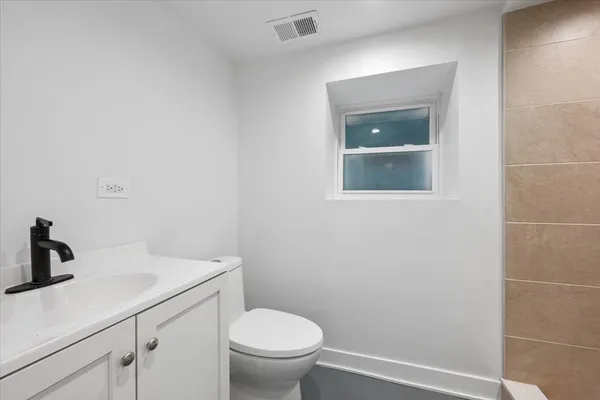 a bathroom with a toilet and sink