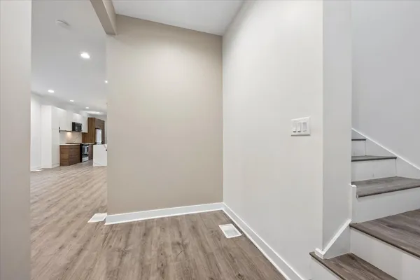 a view of a kitchen from the hallway