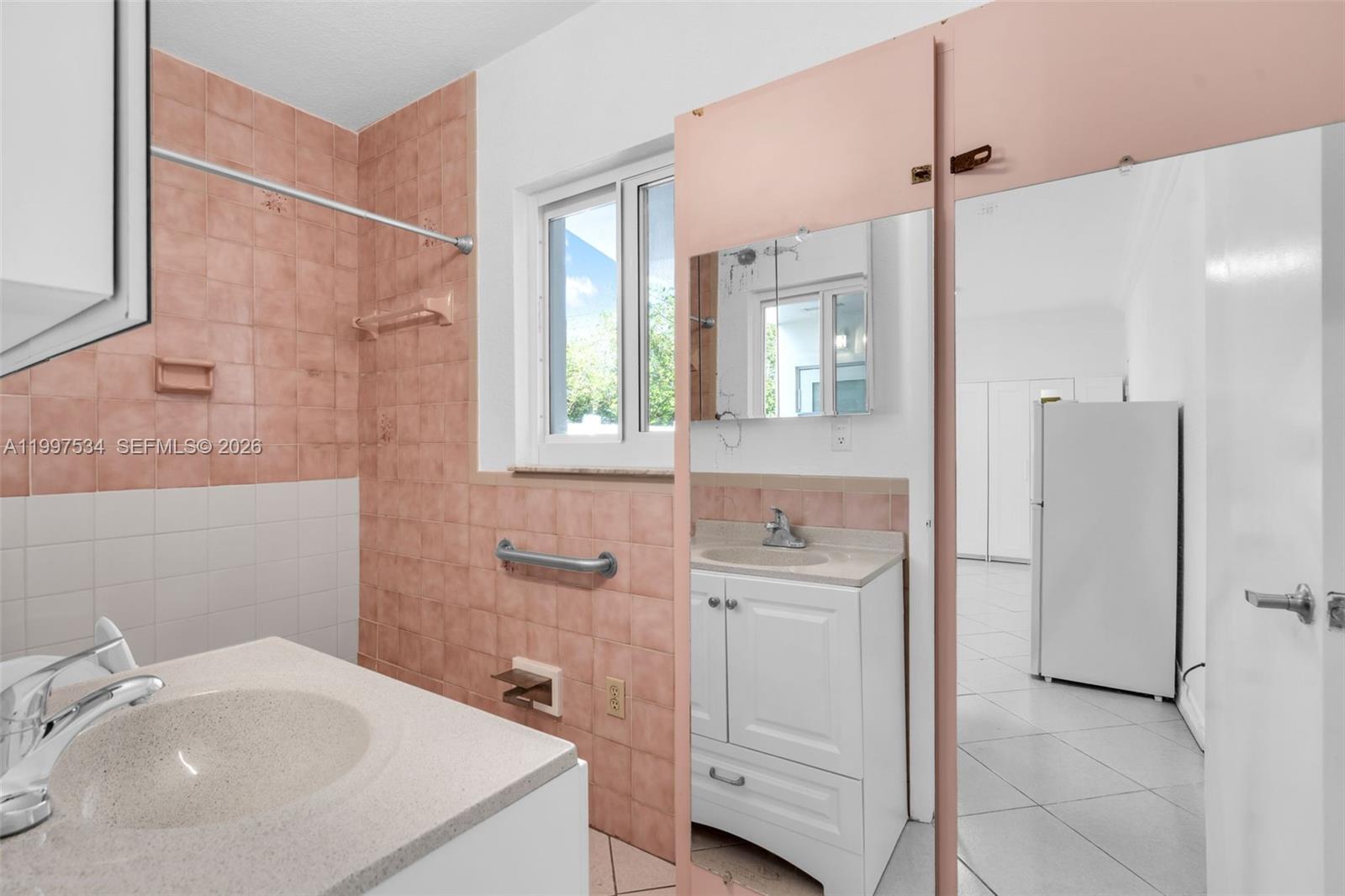 201 Southwest 51st Court, Unit 3 Miami, FL 33134 - Photo 5 of 6 a bathroom with a sink a toilet and shower