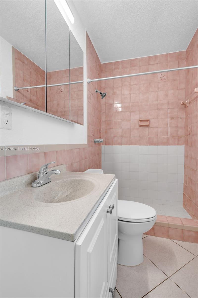 201 Southwest 51st Court, Unit 3 Miami, FL 33134 - Photo 6 of 6 a bathroom with a sink toilet and vanity