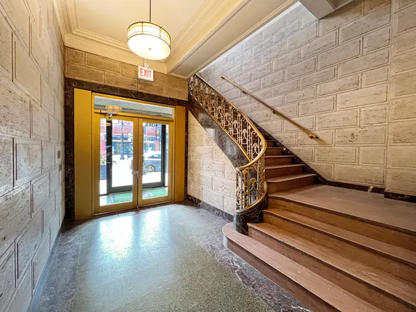 a view of a hallway with staircase