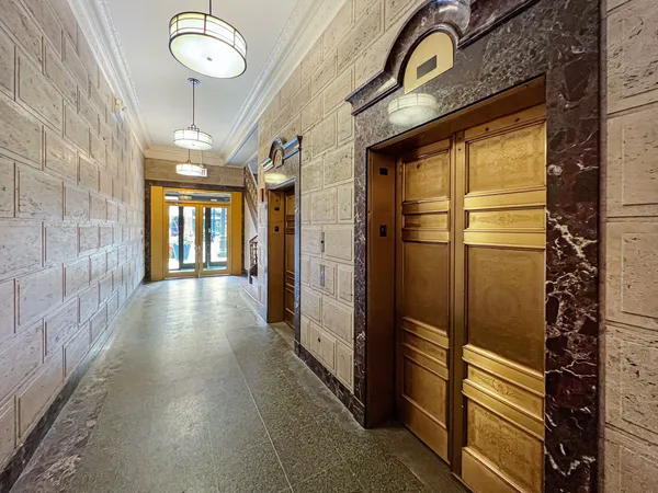 a view of an entryway with wooden floor