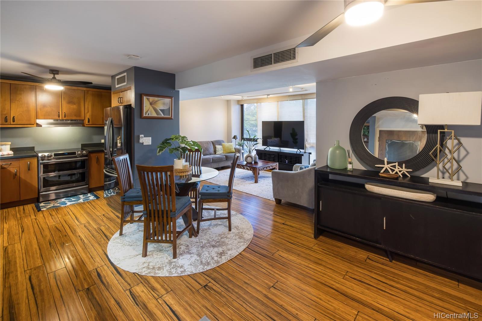 a living room with furniture and a flat screen tv