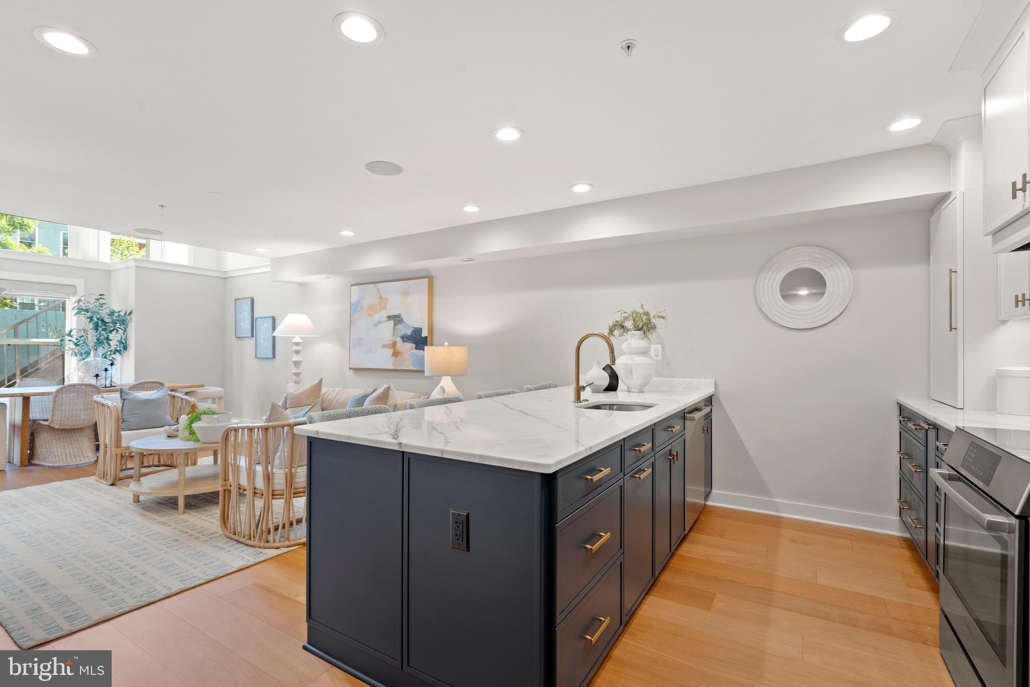 910 9th Street Northeast, Unit 1 Washington, DC 20002 - Photo 13 of 66 a kitchen with a sink and cabinets