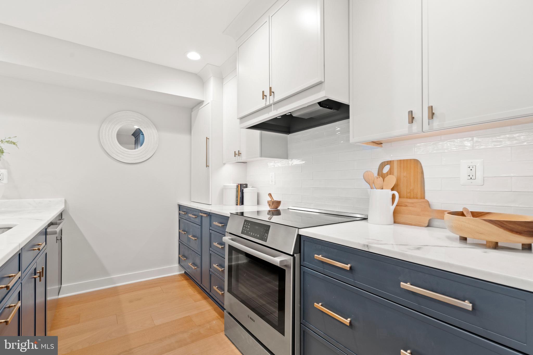 910 9th Street Northeast, Unit 1 Washington, DC 20002 - Photo 14 of 66 a kitchen with stainless steel appliances granite countertop a stove and a sink