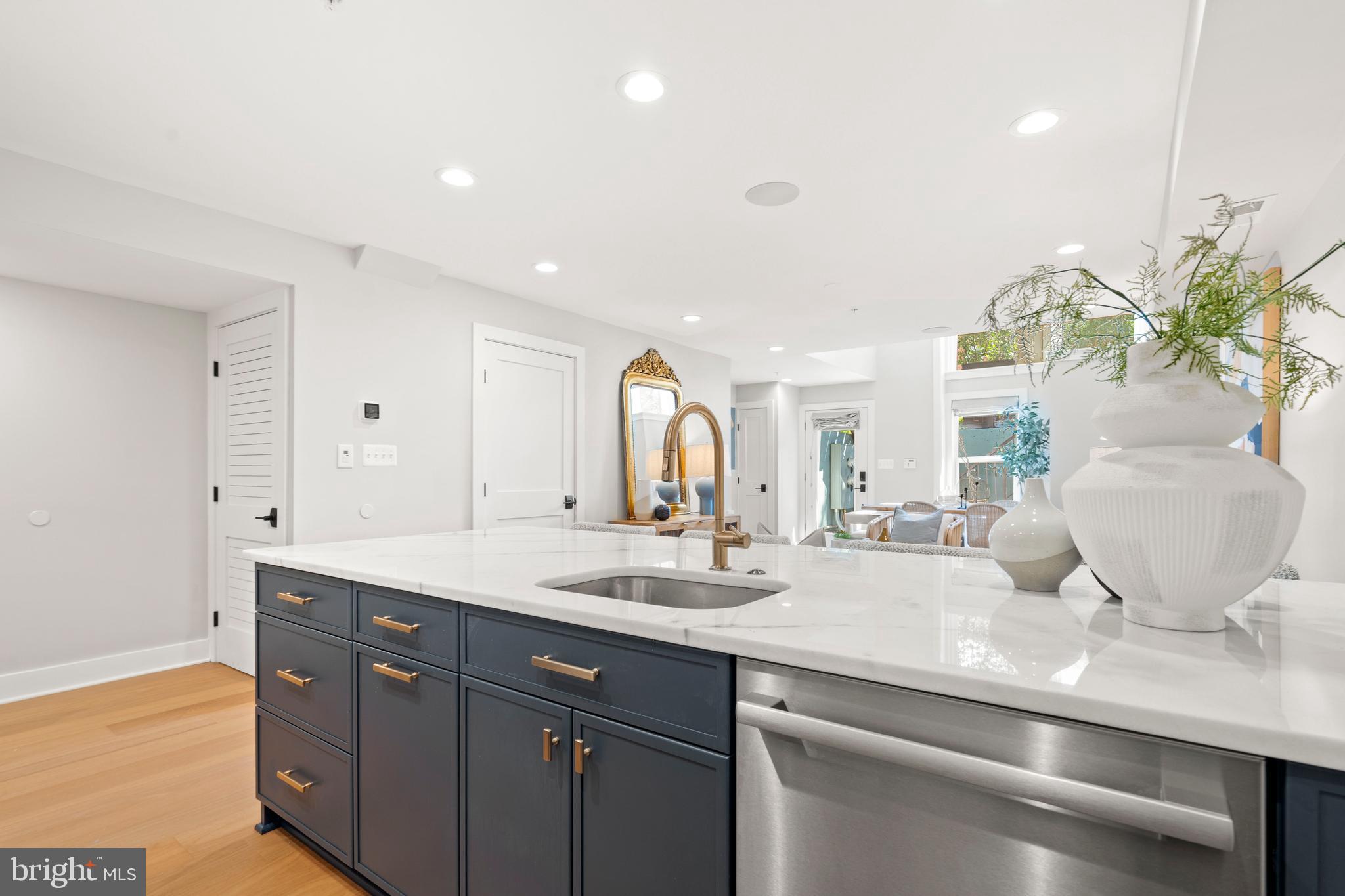 910 9th Street Northeast, Unit 1 Washington, DC 20002 - Photo 16 of 66 a spacious bathroom with a granite countertop sink a mirror and a shower